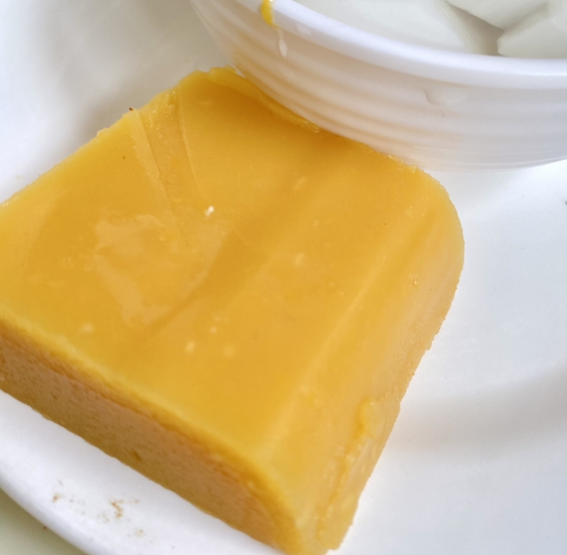 Yellow wandouhuang pea-flour cake on a white plate